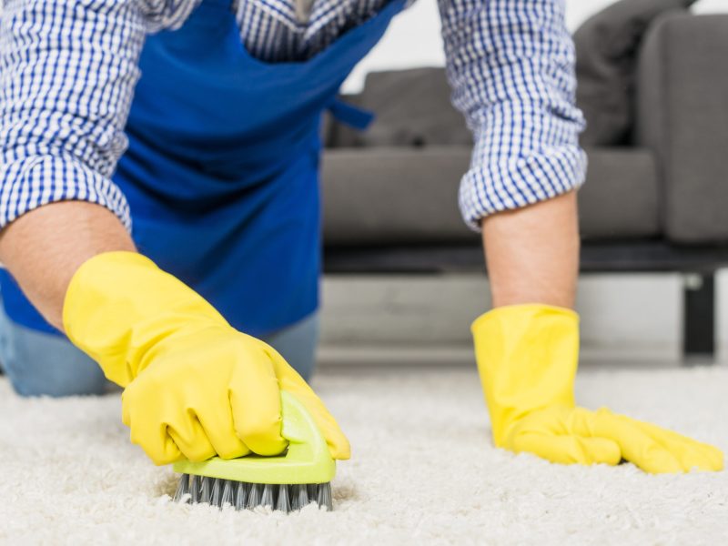 close-up-man-cleaning-his-house close-up-man-cleaning-his-house